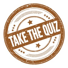 TAKE THE QUIZ text on brown round grungy stamp.