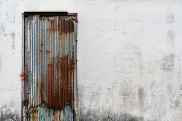 Rusted galvanized iron plate  door used to open and wall background