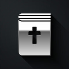 Fototapeta premium Silver Holy bible book icon isolated on black background. Long shadow style. Vector
