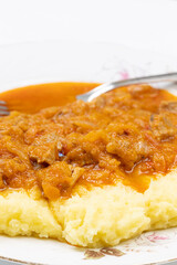 Beef Stew served with mashed potatoes on the plate