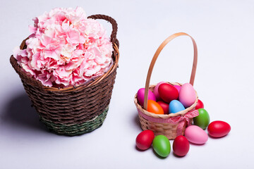 Fototapeta na wymiar Basket with easter eggs isolated on white background