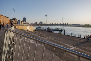 Selective focus at metal fence barrier restrict Rheintreppe, famous staircase at Burgplatz and promenade riverside of Rhine River, from people during lockdown by epidemic of COVID-19 virus.