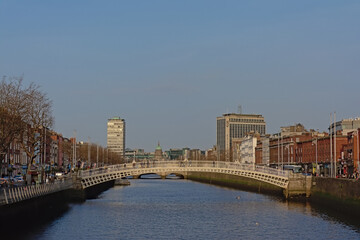 Fototapeta na wymiar Download preview Ha`penny pedestrian bridge over River Liffey in the city of Dublin, Ireland 