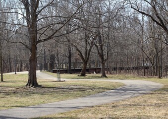 The empty walkway in the country park on a sunny day.