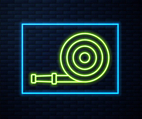 Glowing neon line Fire hose reel icon isolated on brick wall background. Vector