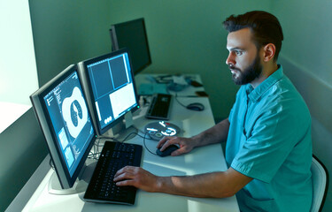 In the medical laboratory, the patient undergoes an MRI or CT scan under the supervision of a...