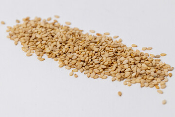 Detail shot of sesame seeds on a white background. Macro shot of sesame seeds. 