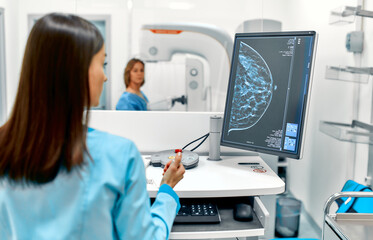 In the hospital, the patient undergoes a screening procedure for a mammogram, which is performed by...