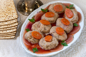 Gefilte fish. Fish cakes on a platter, decorated with beets, markers and parsley.