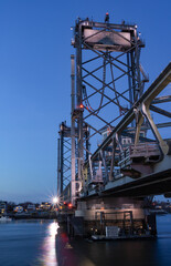 Colorful bridge illuminated at sunset and blue hour