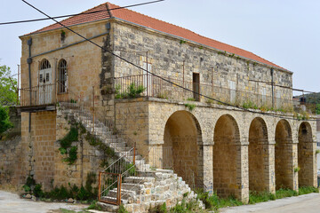 Fototapeta premium A beautiful old abandoned house in arabic village Ein Siniya. In the early 1900s Moshe Sharett lived in this house with his family, Ein Siniya village, Israel.