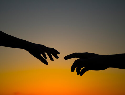 silhouette of hands. Couple love. Hands concept. Idea. Photo. Hope. Help. 