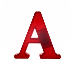 Plastic letter A on magnet isolated on white background, top view