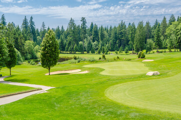 Fototapeta na wymiar Golf course with gorgeous green and pond.