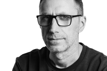 Handsome man in spectacles. Black and white portrait isolated on white