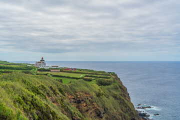 Fototapeta na wymiar Beautiful view over Lighthouse Farol da Ponta da Ferraria, Azores Portugal