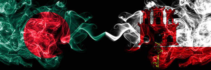 Bangladesh, Bangladeshi vs British, Britain, Gibraltar smoky mystic flags placed side by side. Thick colored silky abstract smokes flags.