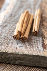 Cinnamon sticks on the wooden background