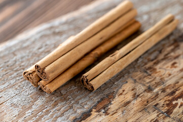 Cinnamon sticks on the wooden background