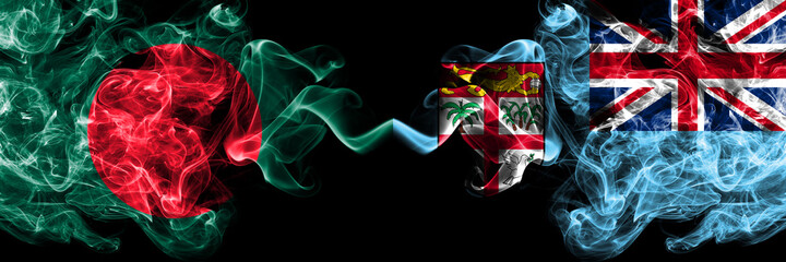 Bangladesh, Bangladeshi vs Fiji, Fijian smoky mystic flags placed side by side. Thick colored silky abstract smokes flags.