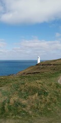 Trevose lighthouse on the coast path cornwall england uk 