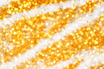 Gold striped background. Golden abstract pattern bokeh blurred beautiful shiny lights Christmas