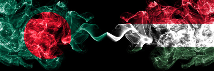 Bangladesh, Bangladeshi vs Hungary, Hungarian smoky mystic flags placed side by side. Thick colored silky abstract smokes flags.