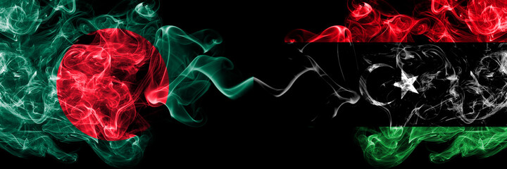Obraz premium Bangladesh, Bangladeshi vs Libya, Libyan smoky mystic flags placed side by side. Thick colored silky abstract smokes flags.