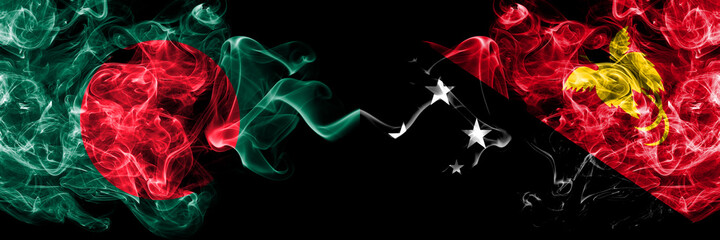Bangladesh, Bangladeshi vs Papua New Guinea smoky mystic flags placed side by side. Thick colored silky abstract smokes flags.