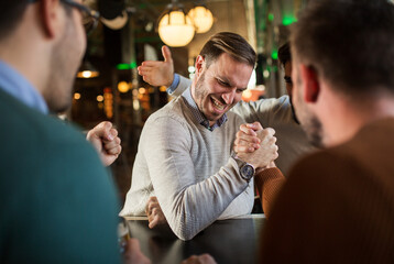 Arm wrestling at beer bar