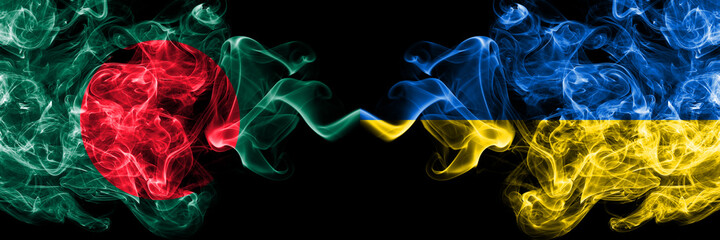 Bangladesh, Bangladeshi vs Ukraine, Ukrainian smoky mystic flags placed side by side. Thick colored silky abstract smokes flags.