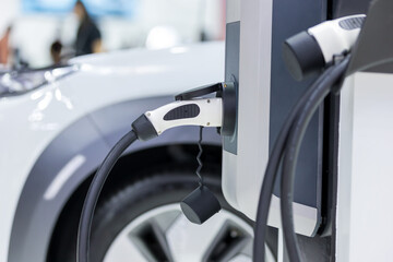 Electric car charging station. Hybrid car Electric charger station in the Car Park. Electric car charging on parking and charging station. Electric socket. Transportation EV