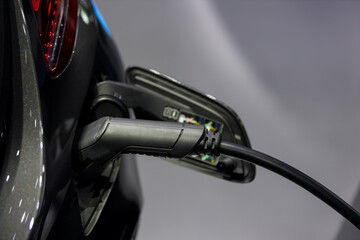 Electric car charging station. Hybrid car Electric charger station in the Car Park. Electric car charging on parking and charging station. Electric socket. Transportation EV