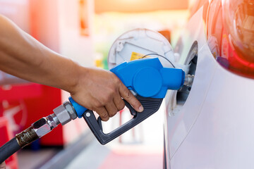 Hand Man Refill and filling Oil Gas Fuel at station. Gas station - refueling. To fill the machine...