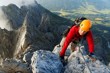 Climbing alpinist on Koenigsjodler route, Austria