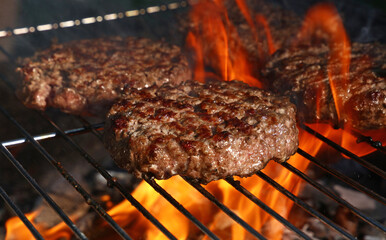 Beef burger for hamburger on barbecue flame grill