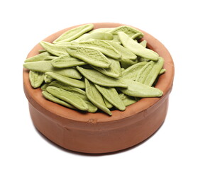 Olive leaf pasta (foglie d'ulivo), dried durum pasta with spinach in clay pot isolated on white background