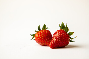 Red strawberries isolated, white background