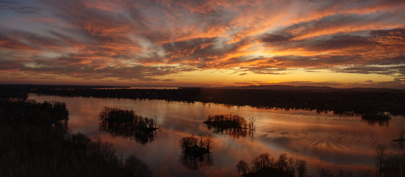 Panoramic aerial view of a dramatic sunset over the river in Laval, Quebec © CELINE BISSON PHOTOS