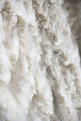 Force of nature at Snoqualmie Falls as the waterfall tumbles with the river in flood
