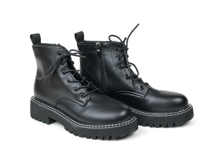 A pair of stylish leather boots isolated on a white background.