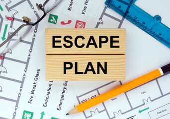 Wooden blocks with text Escape Plan Architectural design, sketch, drawing paper, drawings, simple pencil.