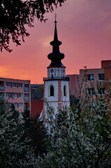 Tower of an evangelical church in Myjava, Slovakia, photographed at beautiful pink sunrise during spring season