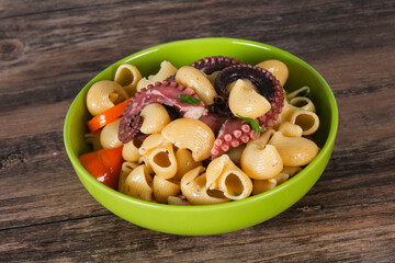 Pasta with octopus and yellow tomatoes