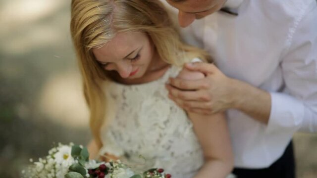 The bride and groom embrace on their wedding day