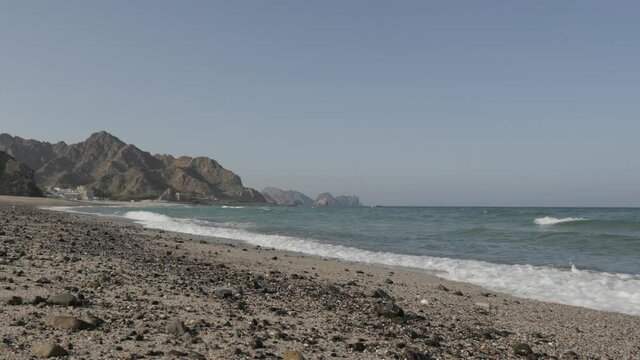 Landscape image of waves at the coast of Muscat, Gulf of Oman.