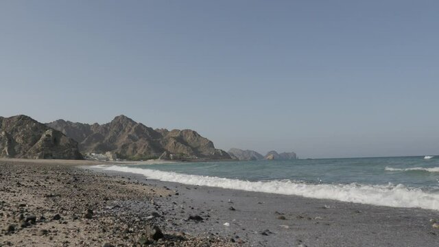Landscape image of waves at the coast of Muscat, Gulf of Oman.