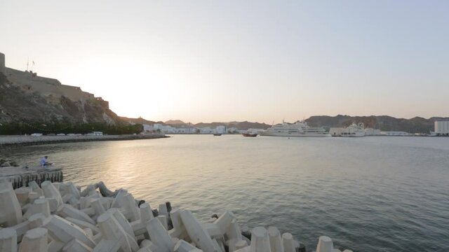Image of Mutrah fort at the coast of Muscat during sunset, Gulf of Oman.