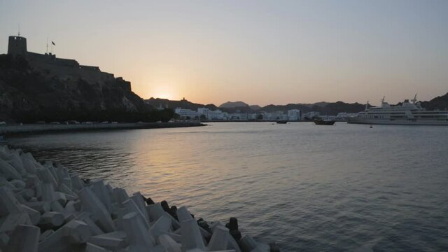 Image of Mutrah fort at the coast of Muscat during sunset, Gulf of Oman.