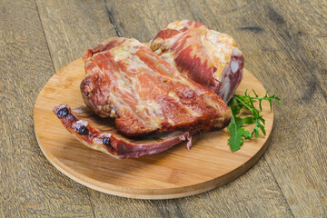 Smoked pork ribs over the wooden background